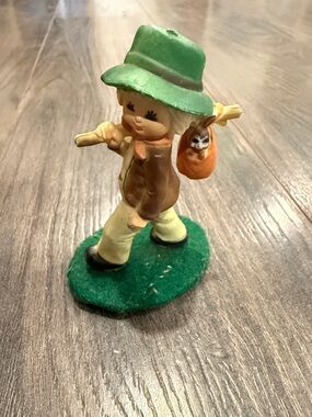 Hand-Painted Boy Figurine with Green Hat